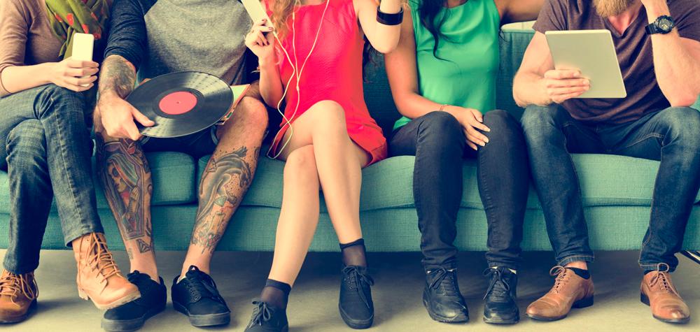 A diverse group of people sitting on a couch